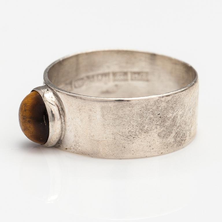 A silver ring and necklace with tiger's eye. Kultasepät Salovaara, Turku 1961.