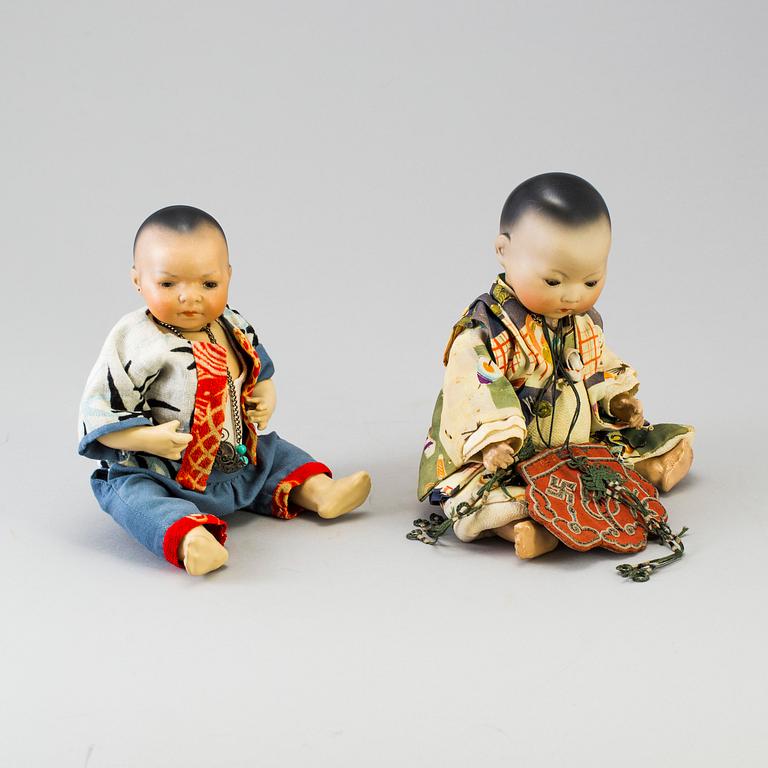 Two oriental bisque head baby dolls by Armand Marseille and Heubach Köppelsdorf, Germany, early 20th century.