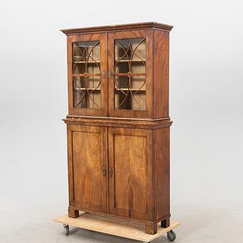 A mid 1800s mahogany book cabinet.
