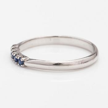 A 14K white gold ring with sapphires.