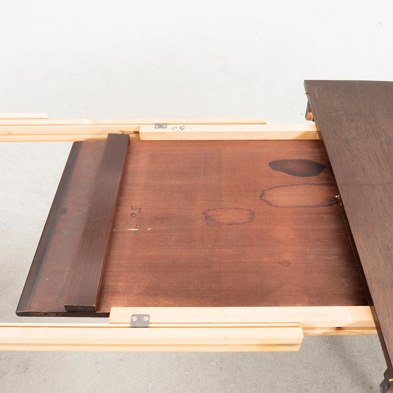 A table and four chairs in lacquered mahogany by David Rosén, "Triva-diné", middle of the 20th century.