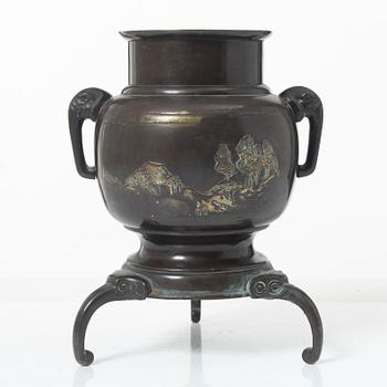 A Japanese bronze tripod vase, Meiji period (1868-1912).