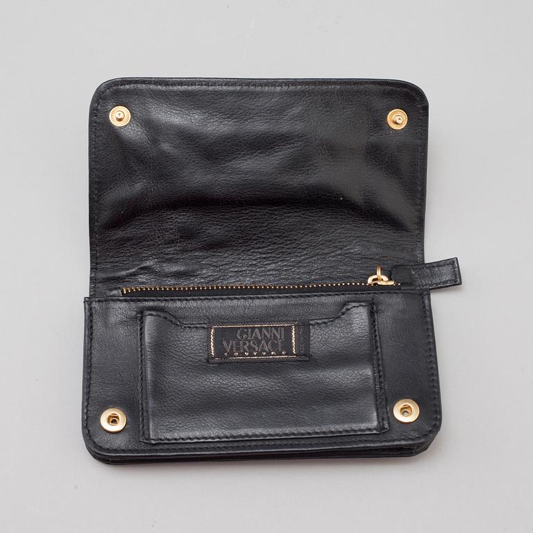 a VERSACE wallet.