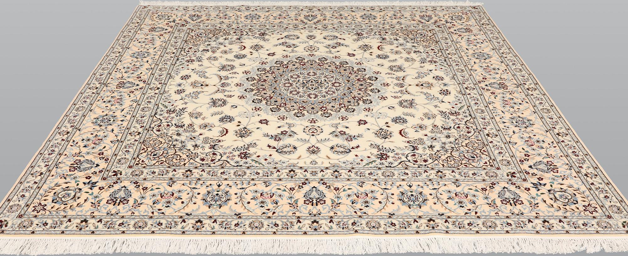 A Nain part silk carpet, c. 207 x 208 cm.