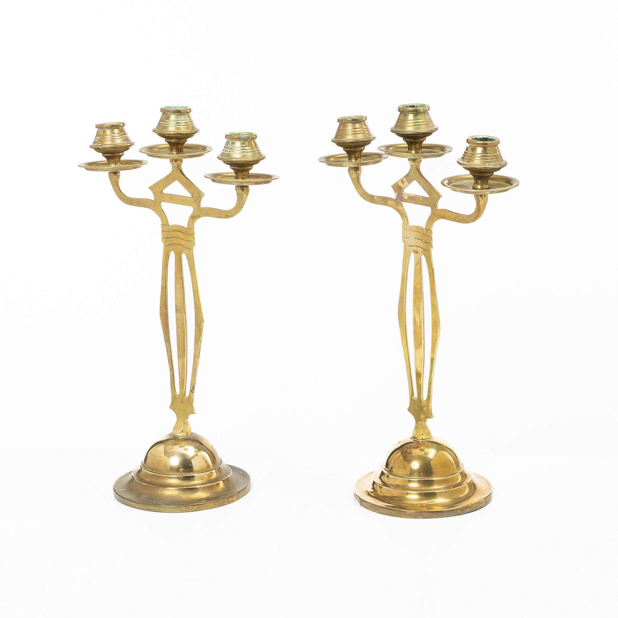 Jugend/Art Nouveau, A pair of brass candelabra, early 20th century.