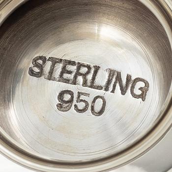 Two sterling silver tea strainers with stands, 20th century.