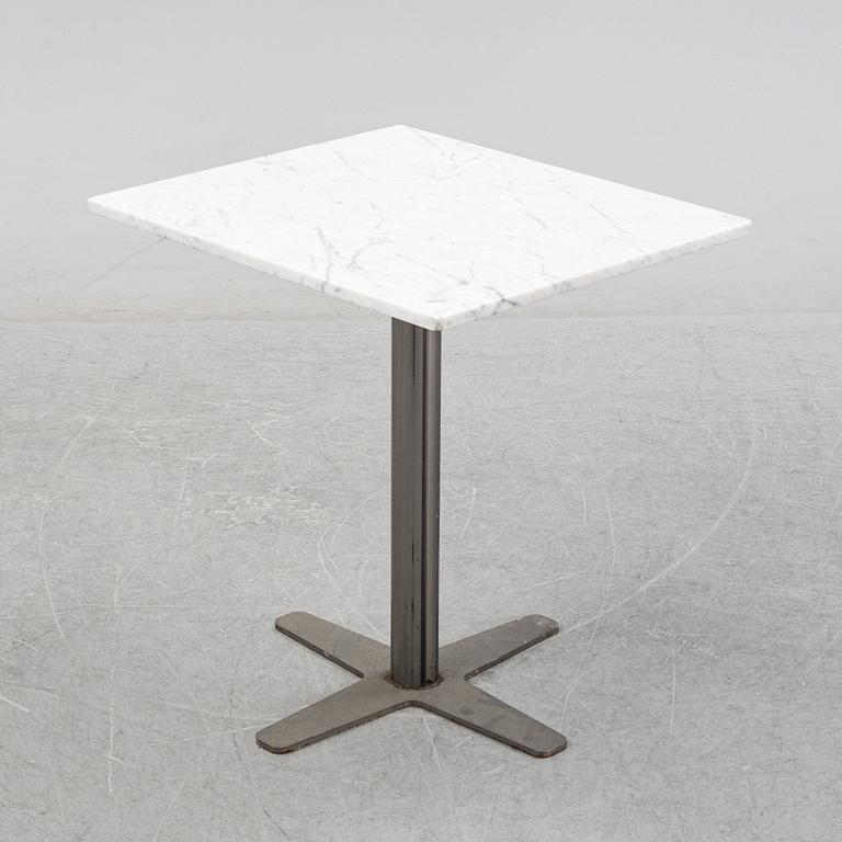 A marble top table, 21th century.