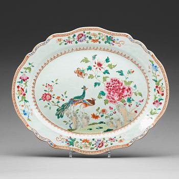 634. A famille rose 'double peacock' serving dish, Qing dynasty, Qianlong (1736-95).