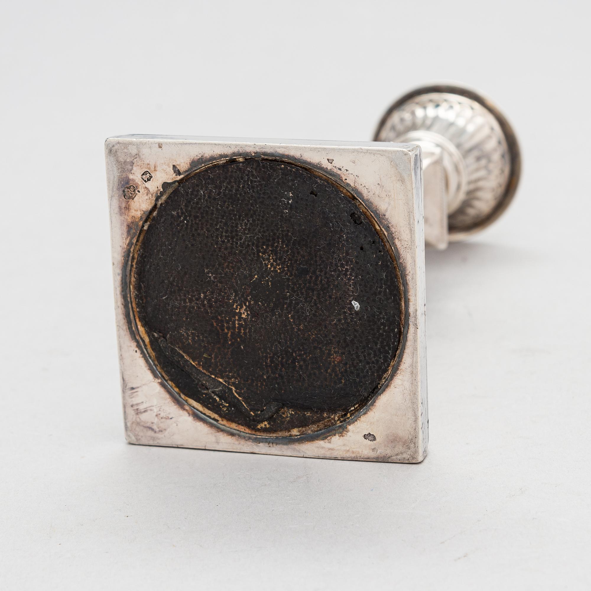 A late 19th-century sterling silver candlestick, maker's mark of William Hutton & Sons, London 1893.