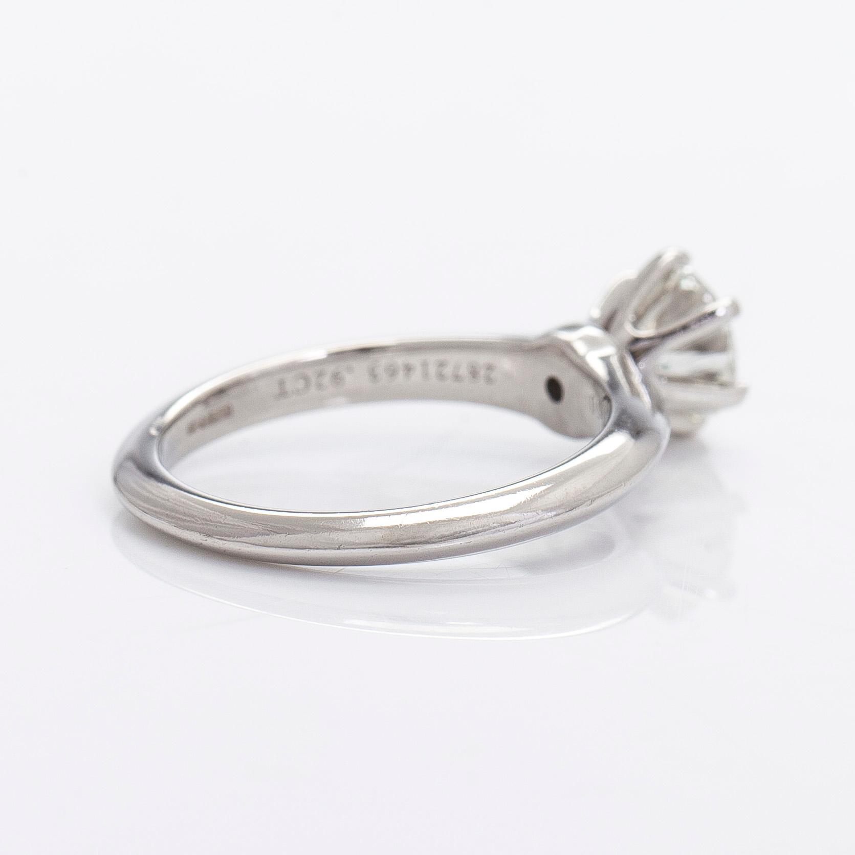 Tiffany & Co, a platinu solitaire ring with a brilliant-cut diamond.