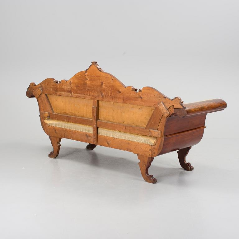 A mid 1800s mahogany sofa.