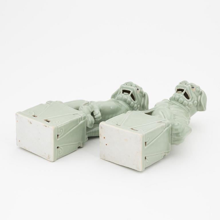 A pair of celadon glazed figures of buddhist lions, China, 20th Century.