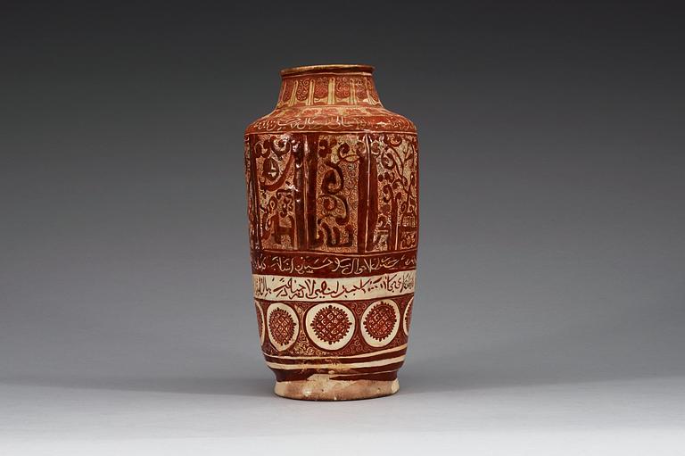 A JAR, lustre-decorated pottery. Height 32 cm. Central Persia (Iran) 12-13th century. Kashan style.