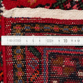 A Hosseinabad runner, c. 410 x 85 cm.