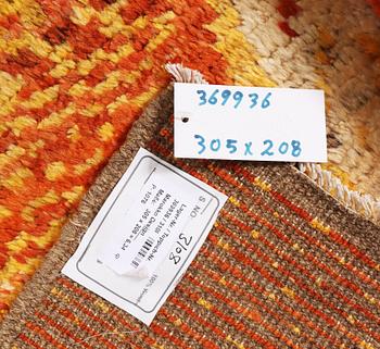 A Moroccan carpet, c. 305 x 208 cm.