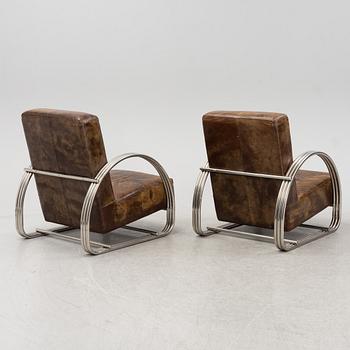 A pair of 'Hudson Street' lounge chairs from Ralph Lauren home.