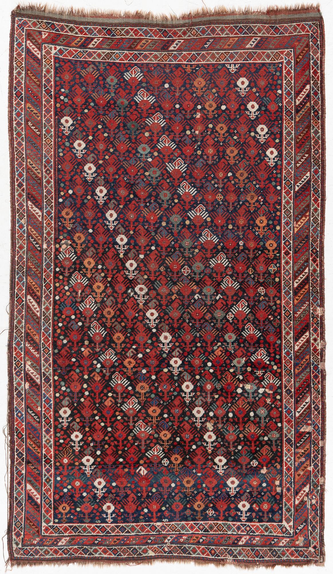 An antique Qashgai rug, 230 x 135 cm.