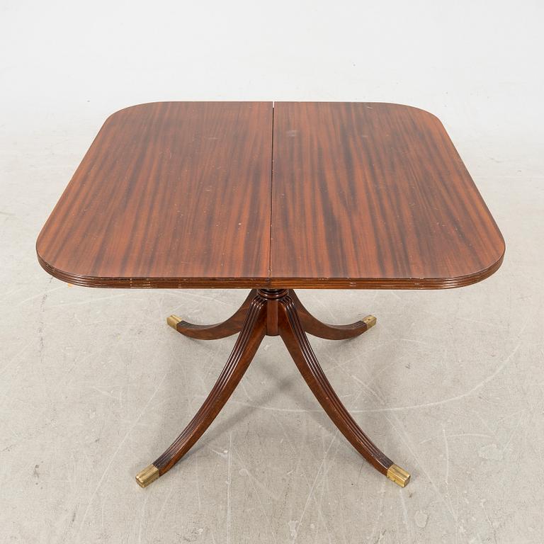 A mid 1900s English style mahogany dining table.