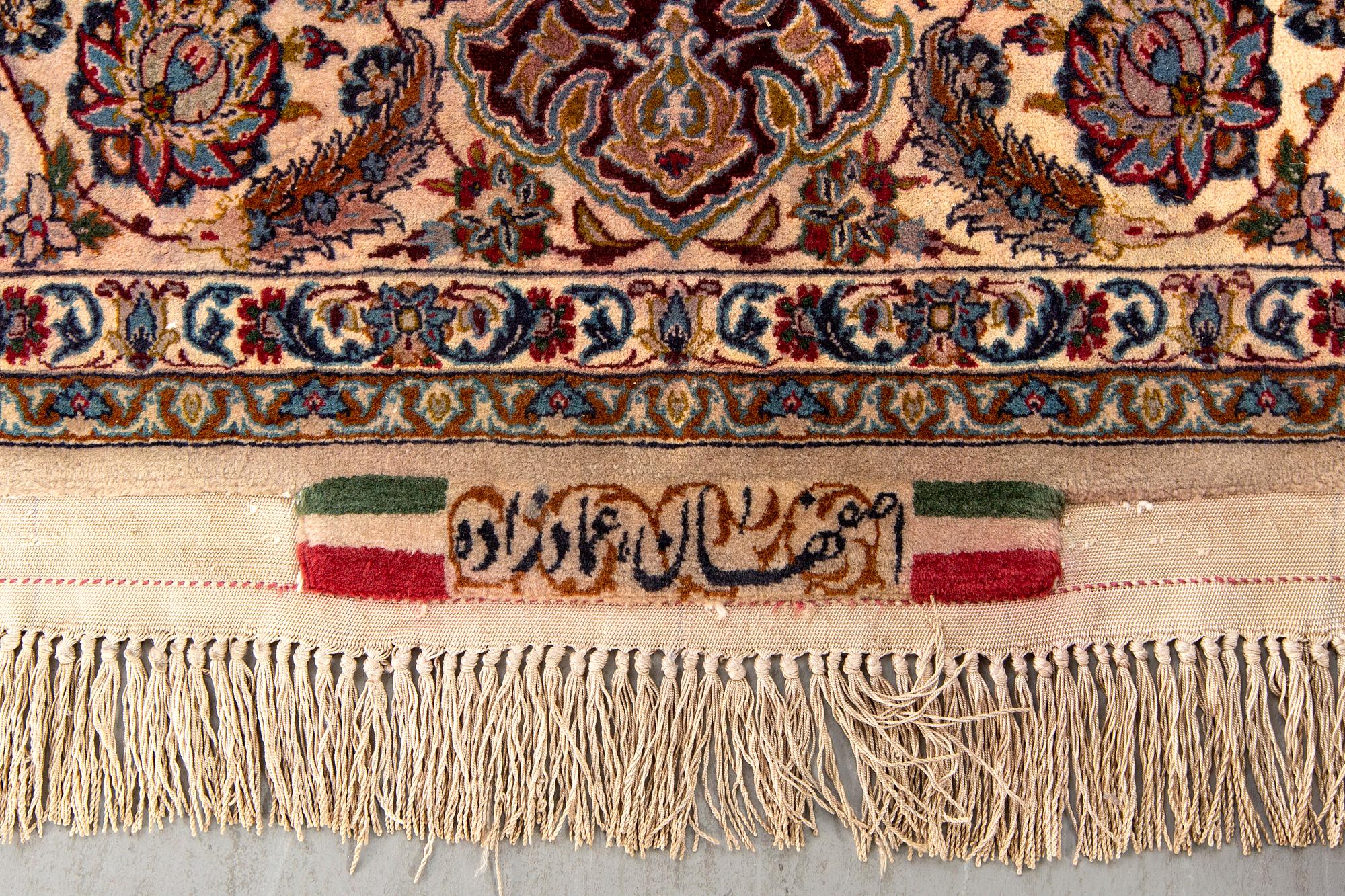 A signed isfahan part silk carpet ca 192 x 118 cm.
