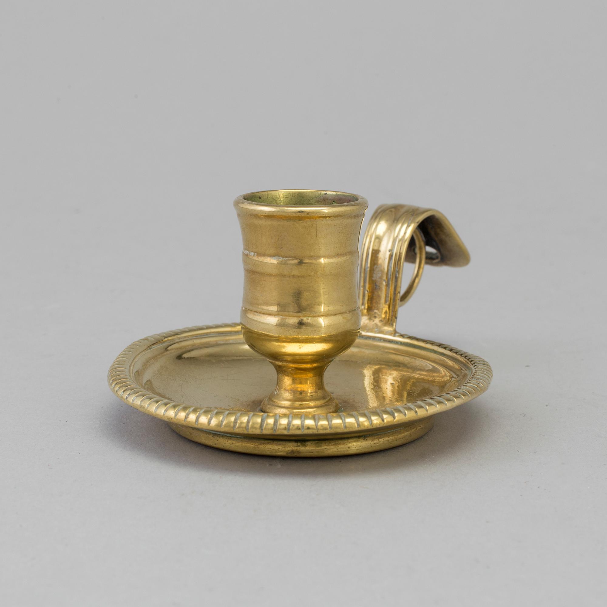 AN 18TH CENTURY BRONZE NIGHT LIGHT.