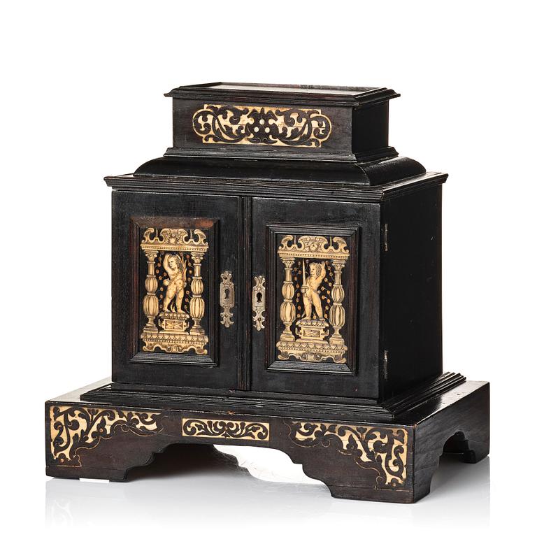 A South German, presumably Augsburg, ebony, ebonised and engraved bone inlaid table cabinet,  17th century.