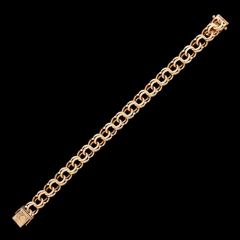 ARMBAND, 18 k guld, bolidenguld, 1947. Total vikt ca 31 g.