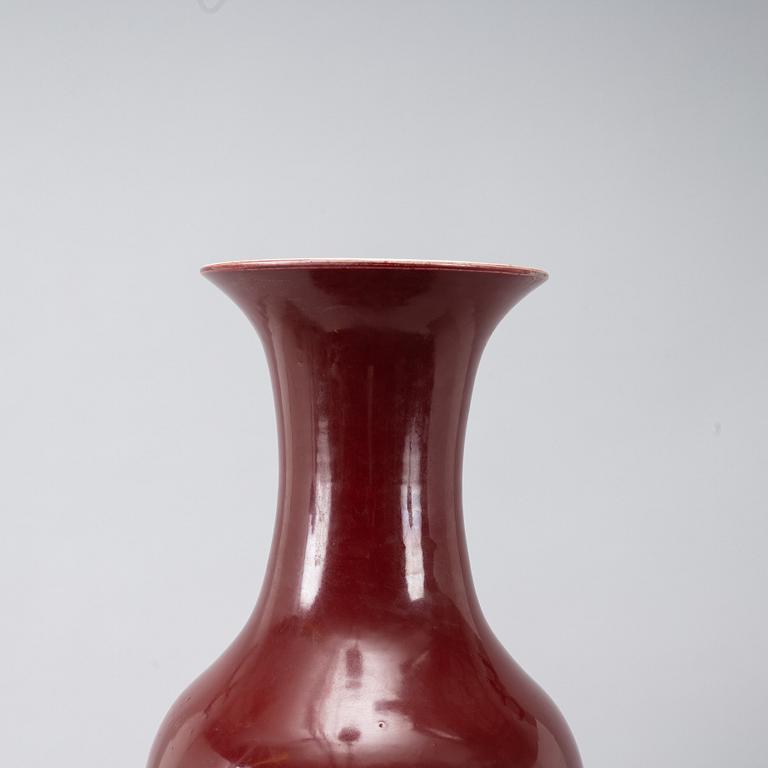 A massive red Chinese porcelain floor vase, modern production.