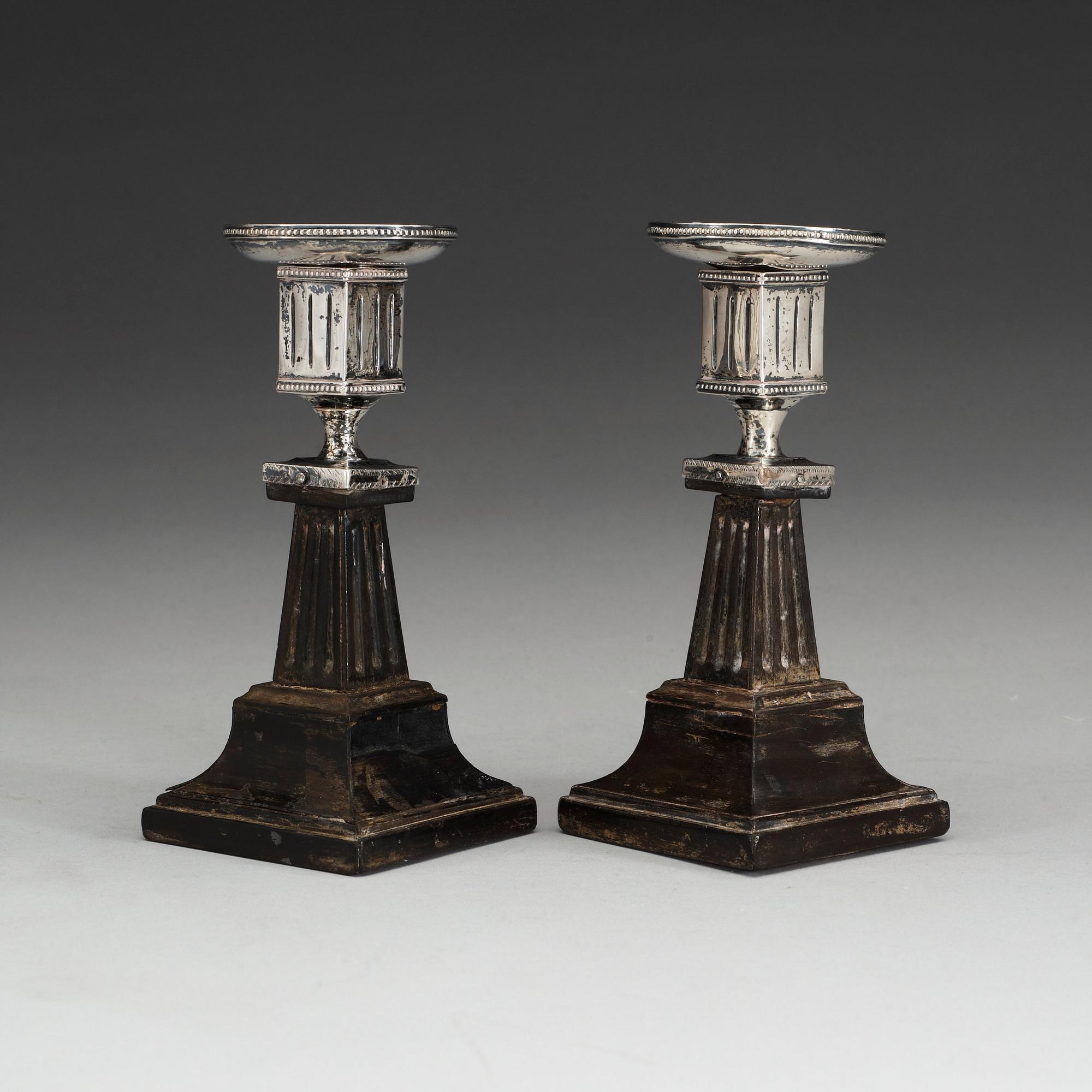 A pair of Swedish early 19th century silver and wood candlesticks, marks of Lorenz Georg Weis, Norrköping (1791-1829).