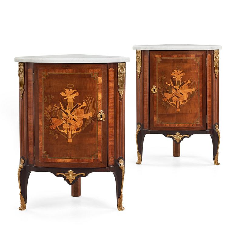 A pair of Louis XVI late 18th century corner cupboards by Léonard Boudin (1735-1804), master in Paris 1761.