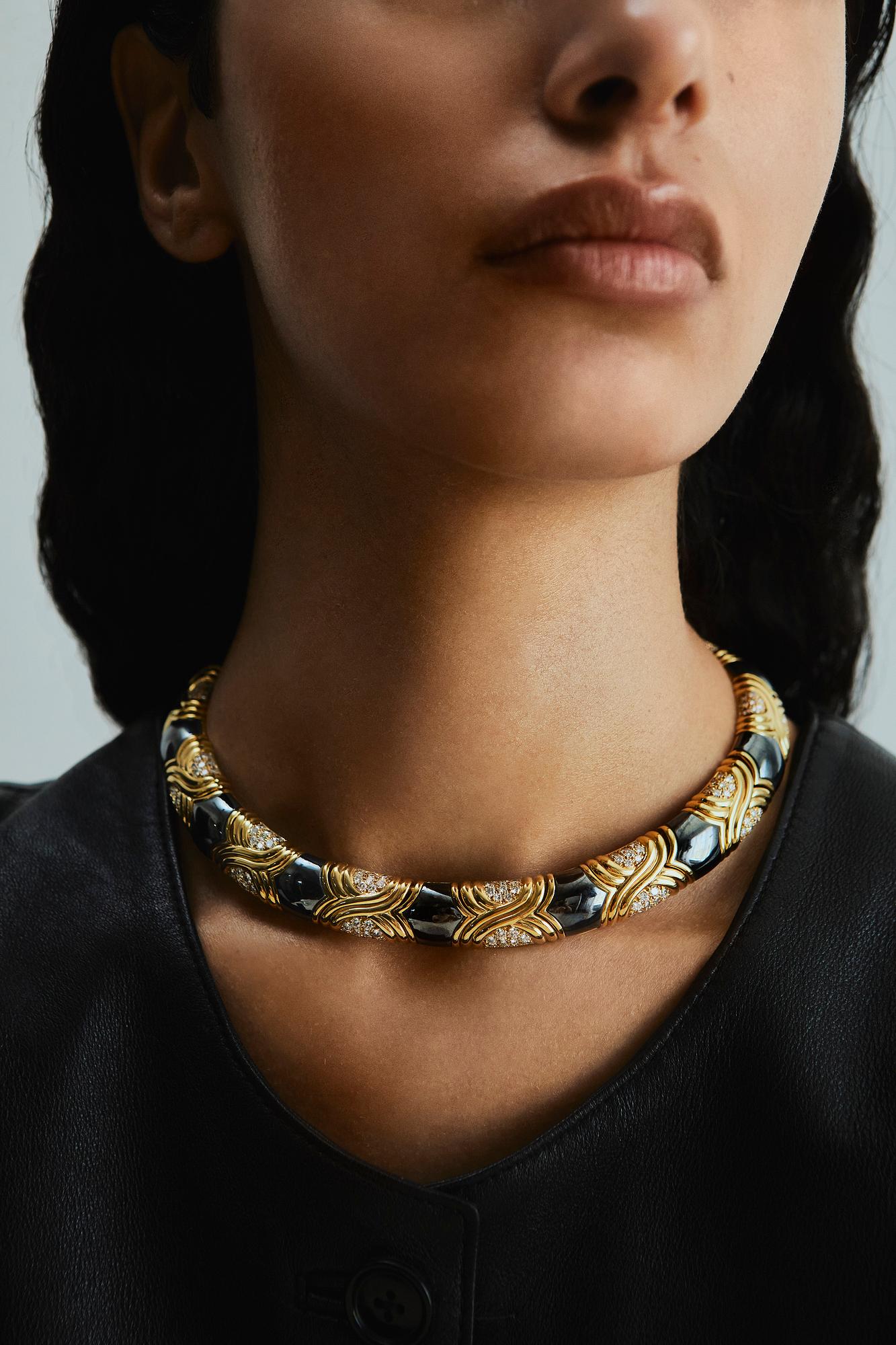 A Bulgari 18K gold and hematite necklace set with round brilliant-cut diamonds.