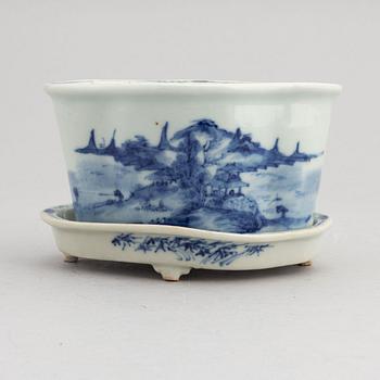 A Chinese blue and white flower pot with stand, around the year 1900.