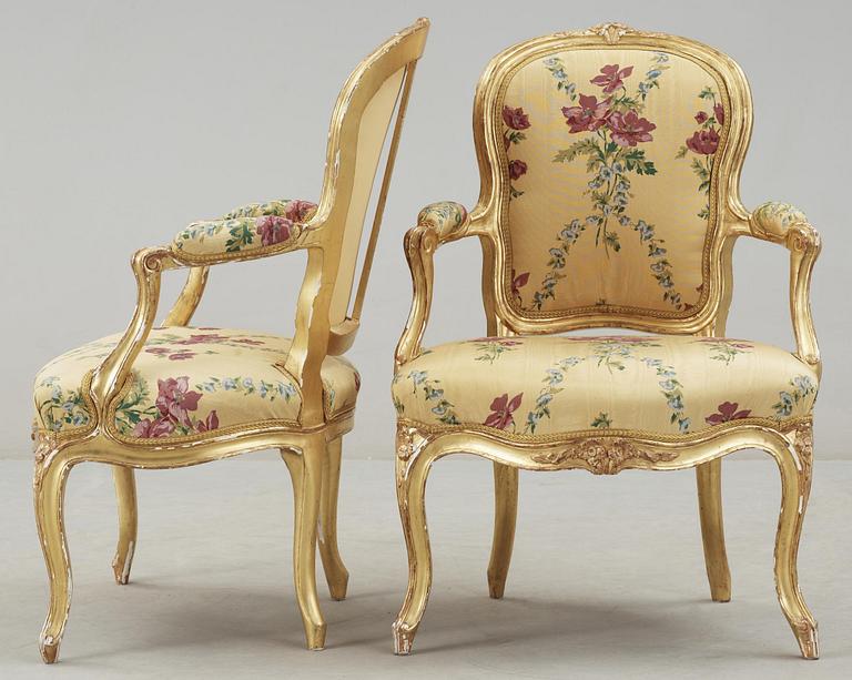 A pair of Louis XV 18th century armchairs, possibly by Claude-Etienne Michard.