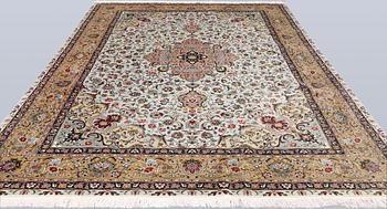 A Tabriz carpet, part silk, so-called 50 Raj, approx. 348 x 252 cm.