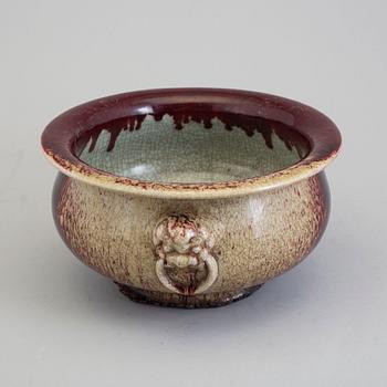 A large red glazed tripod censer, 20th century.