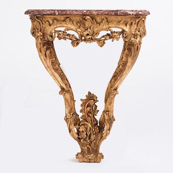 A Central European Louis XV carved and giltwood console table, mid 18th century.