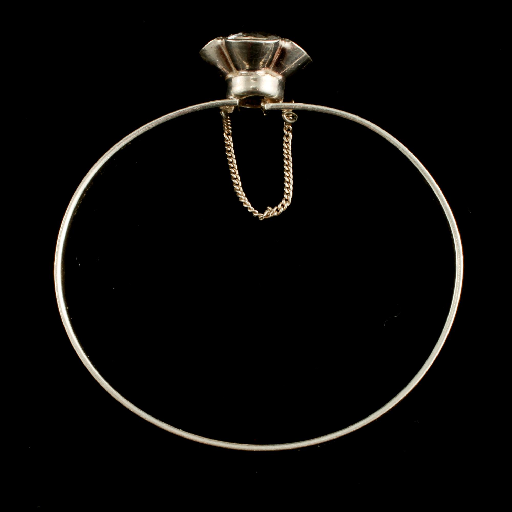 ARMRING, sterlingsilver med fasettslipad bergkristall, Alton, Falköping, 1975. Vikt 13 g.