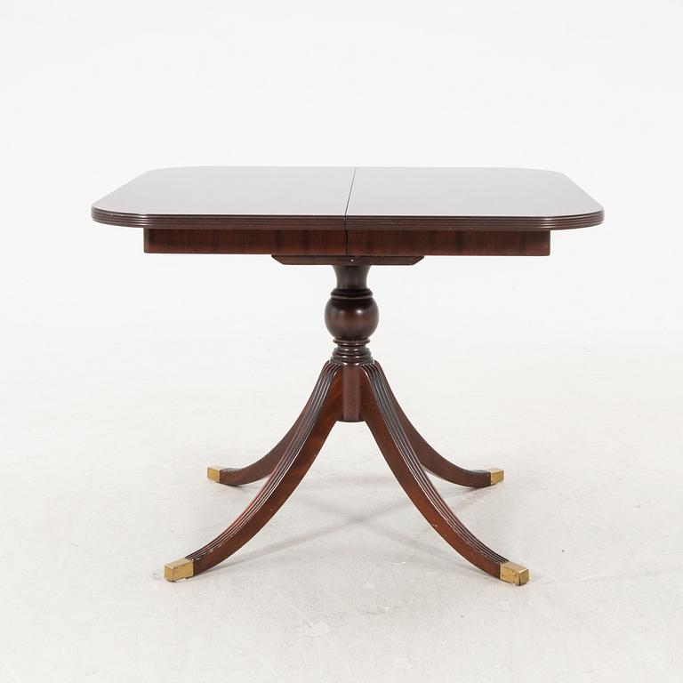 AN English mahogany dining table later part of the 20th century.
