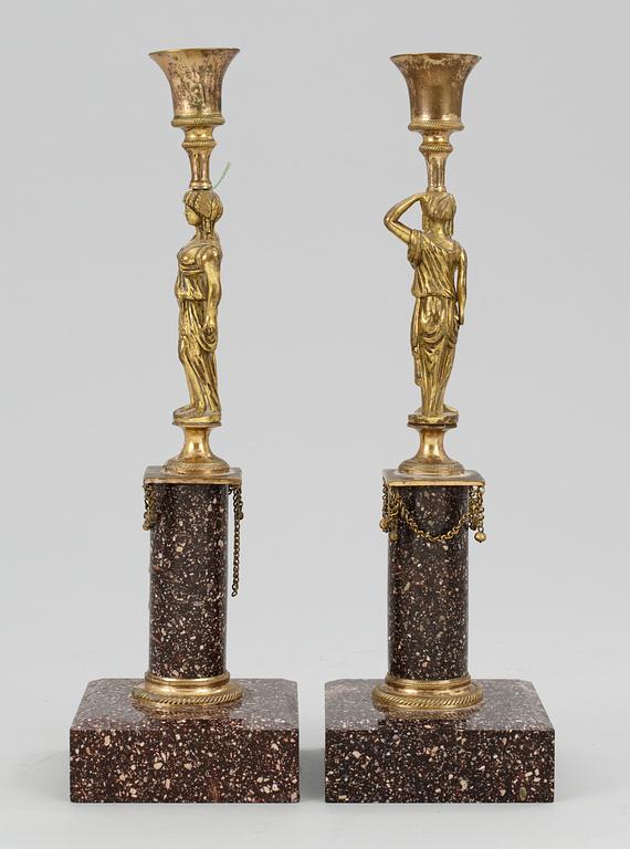 A pair of late Gustavian porphyry candlesticks.