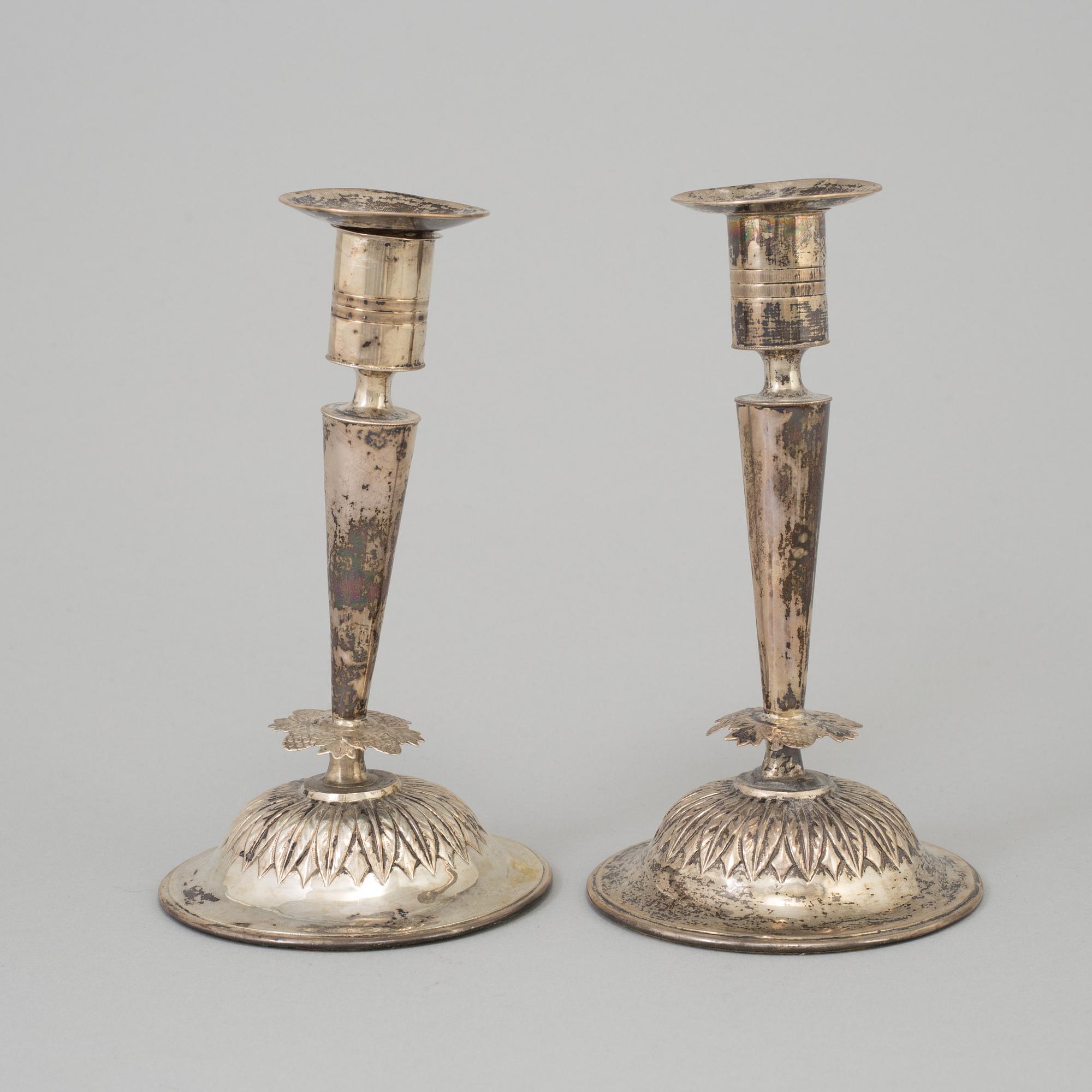 A pair of empire silver candles, presumably Stockholm, dated 1819.