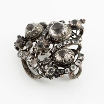 A brooch, a brooch pin, and a pendant, likely 19th century.