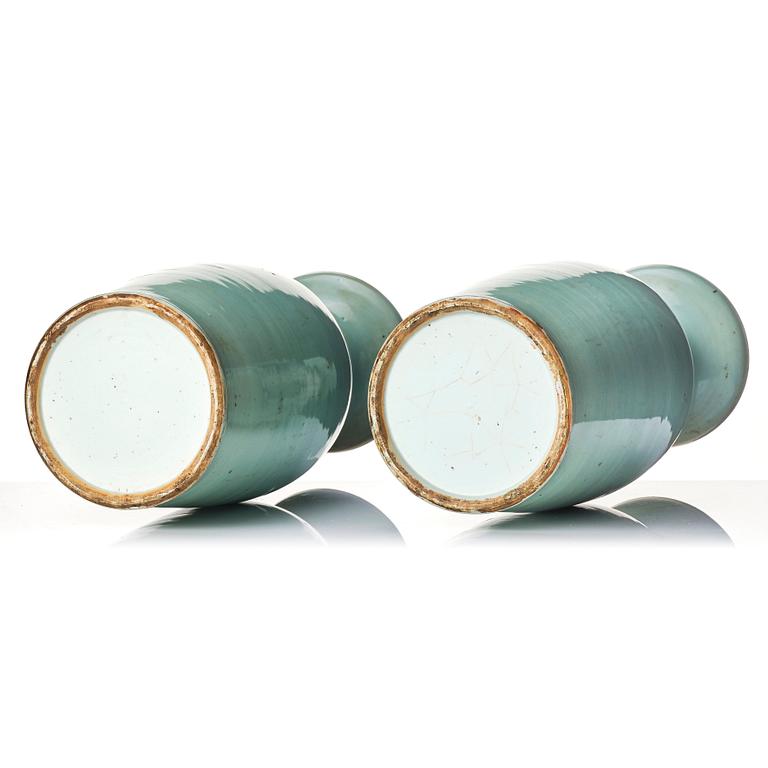 A pair of blue and white vases with celadon ground decorated with Buddhist lions, late Qing dynasty/circa 1900.