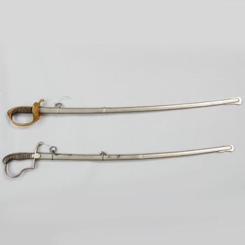 Two Swedish sabres, end of the 19th Century, with scabbards.