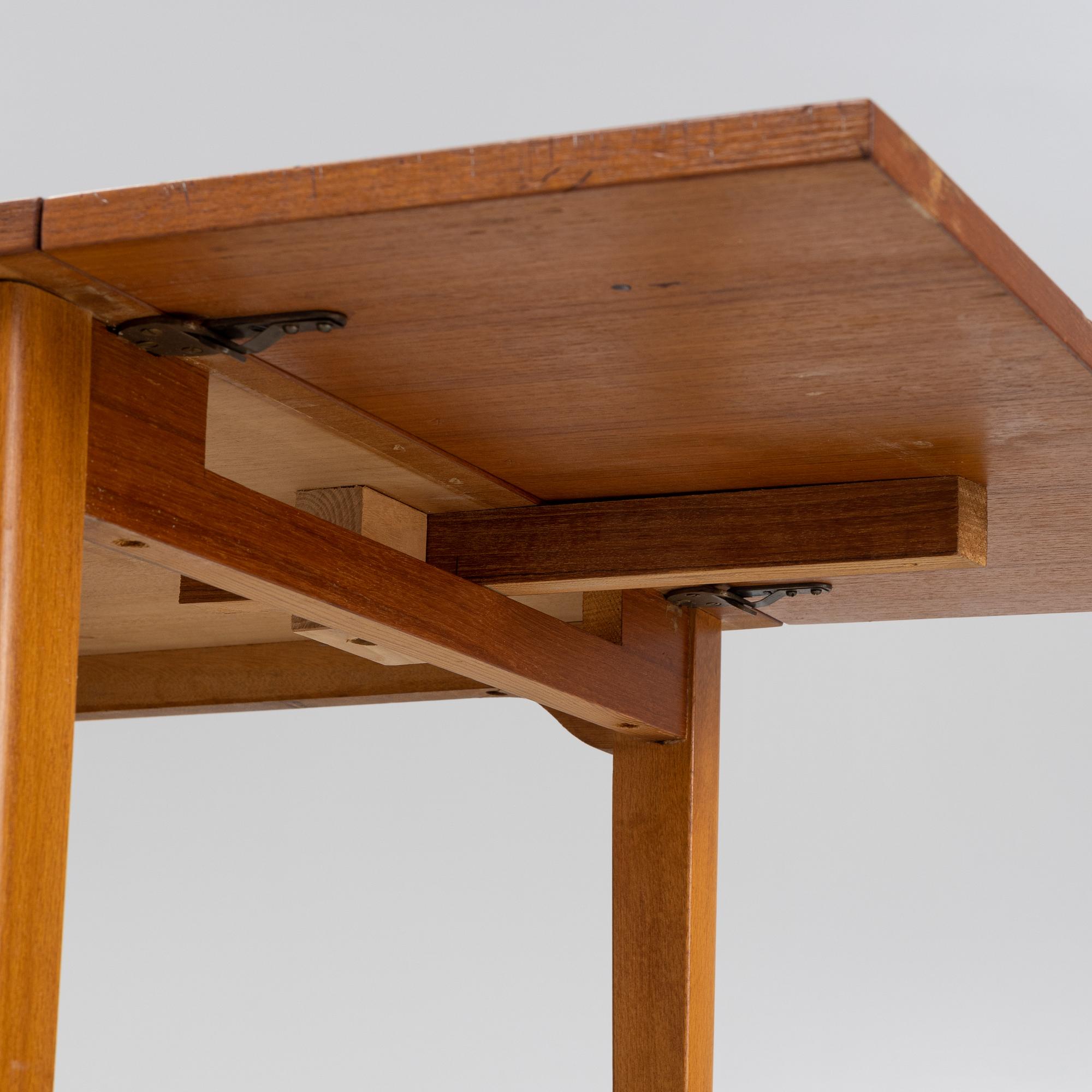 A teak veneered desk, mid 20th Century.