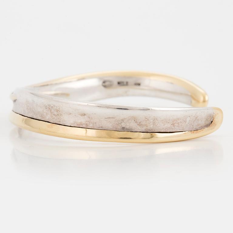 A Georg Jensen silver bangle.