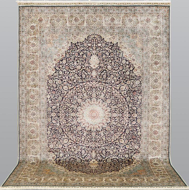 An oriental silk carpet, c. 297 x 202 cm.