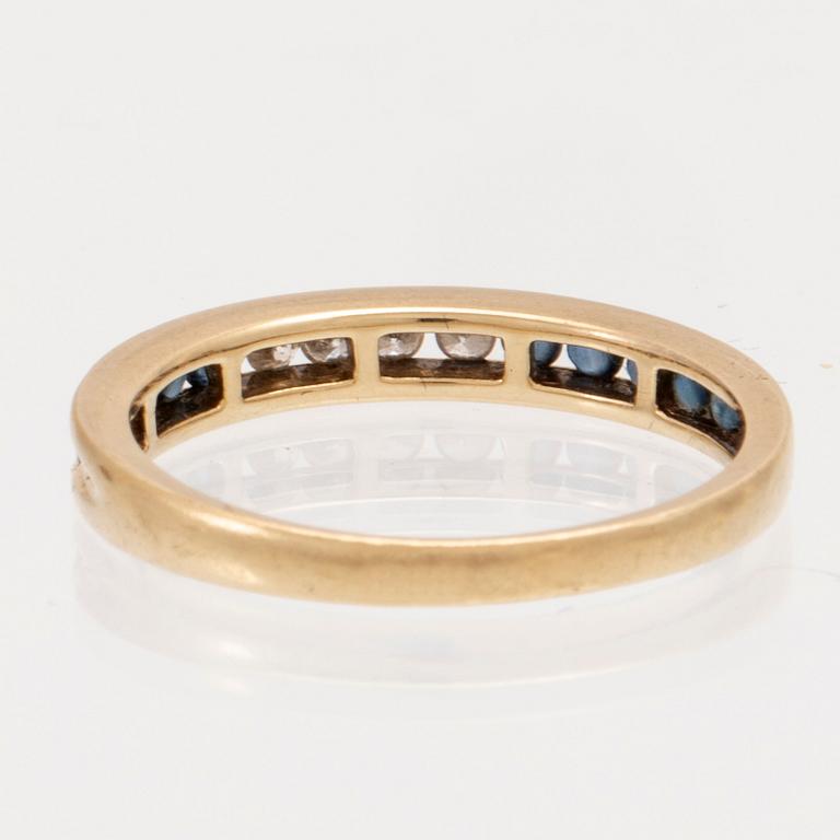 An 18K gold ring and a pair of earrings by H. Stern set with round brilliant cut diamonds and sapphires.