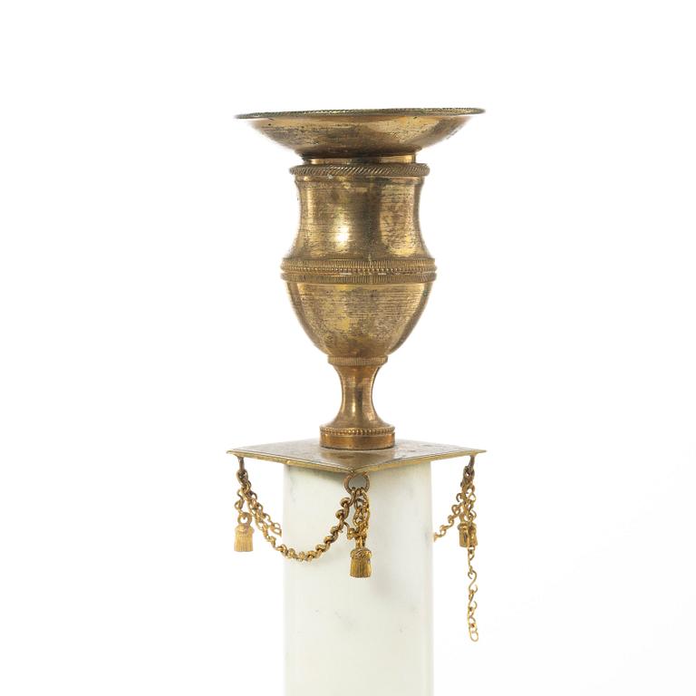 A pair of late Gustavian gilt brass and marble candlesticks, circa 1800.