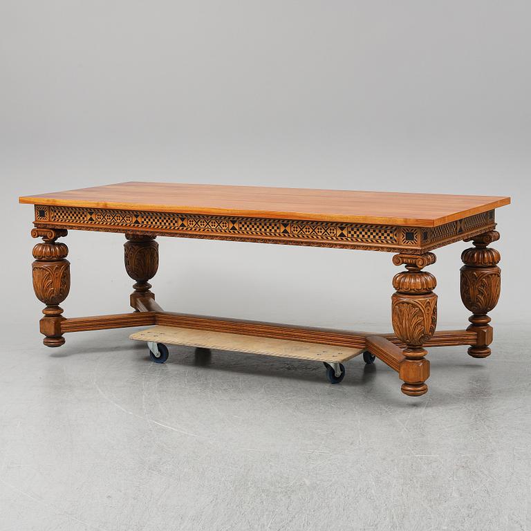 A 20th century baroque-style mahogany table.