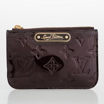 LOUIS VUITTON, nyckelringar 3 st samt plånbok.