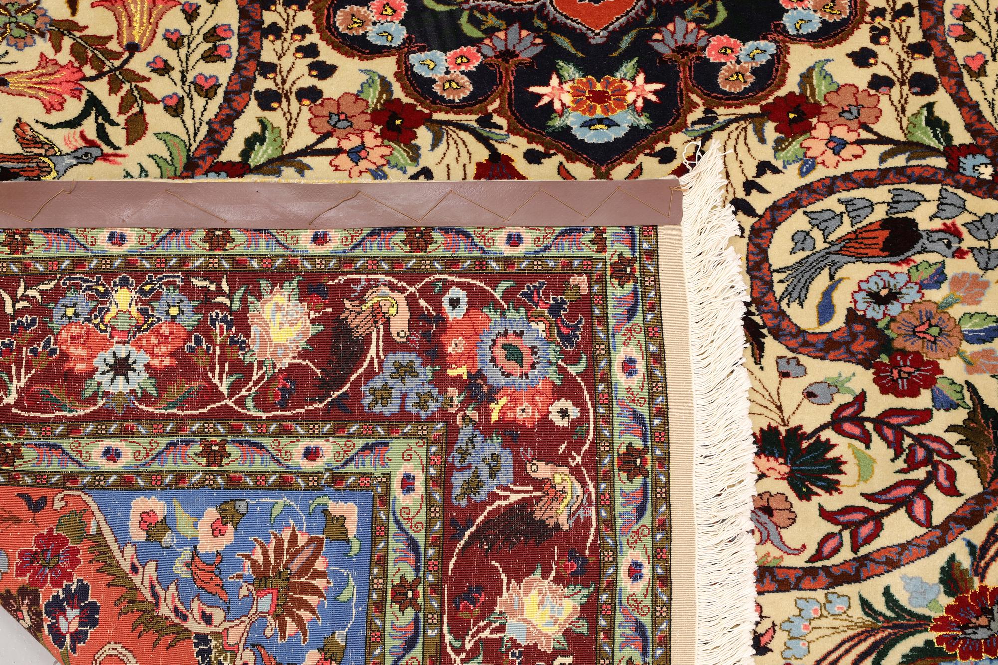 A part silk Tabriz rug, so-called 50 Raj, approx. 242 x 178 cm.